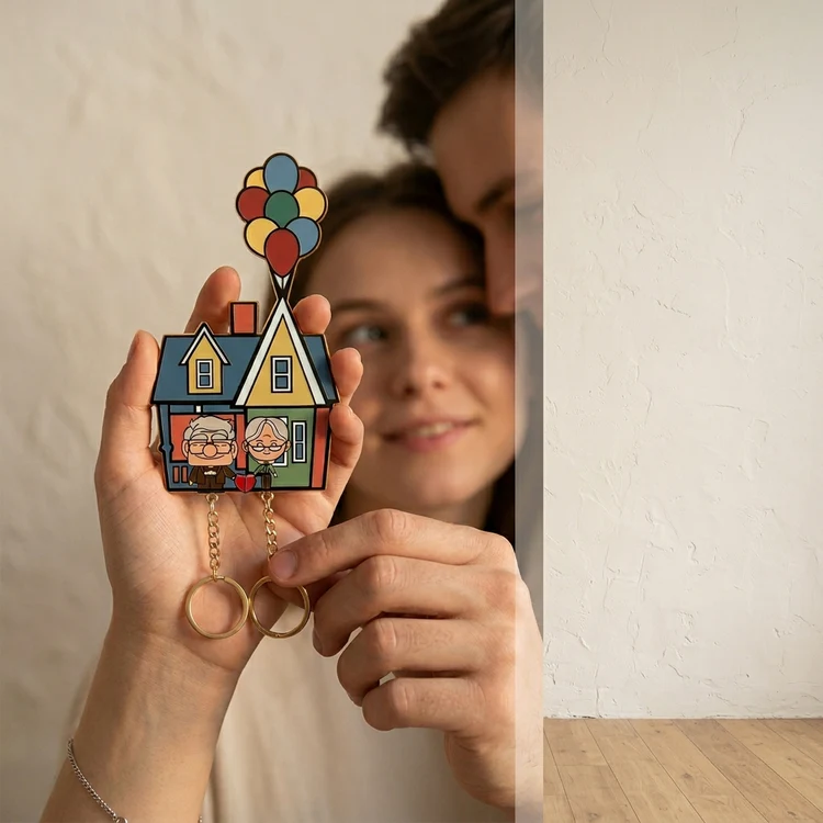 Couple holding the Up house key holder